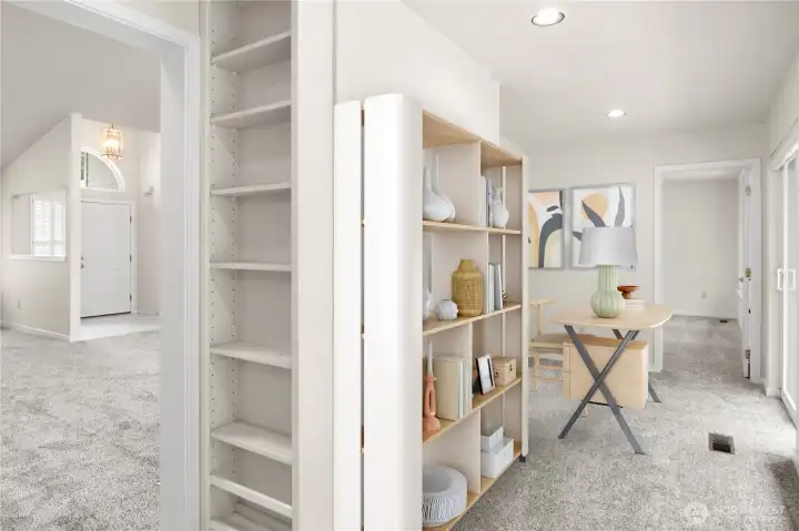 Each side of the bonus space has built in bookshelves. virtually staged