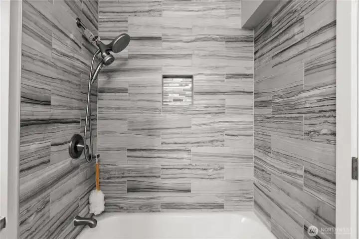 Enjoy this gorgeous soaking tub with beautiful tile surround!