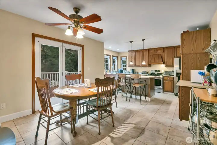 Convenient, spacious eating area just off the kitchen with direct access to the deck for indoor-outdoor living.