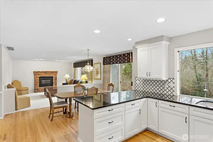 Dining area off kitchen w/ eat-in bar top