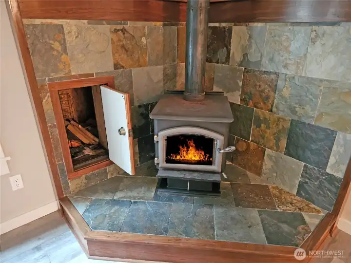 No need to haul firewood thru the home with the external woodbox filled from the outside