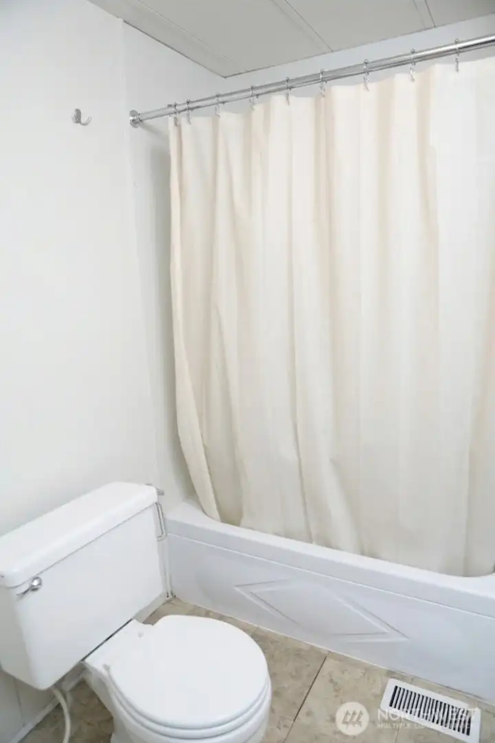 Ensuite bathtube with lots of storage not seen in this pic.