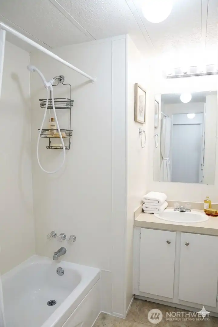 Hall full bath servicing the two bedrooms of the hall.