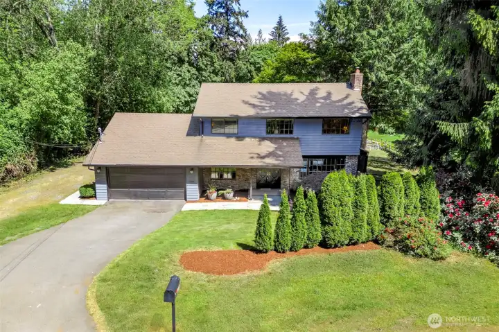 two story home on shy acre, private and beautiful.