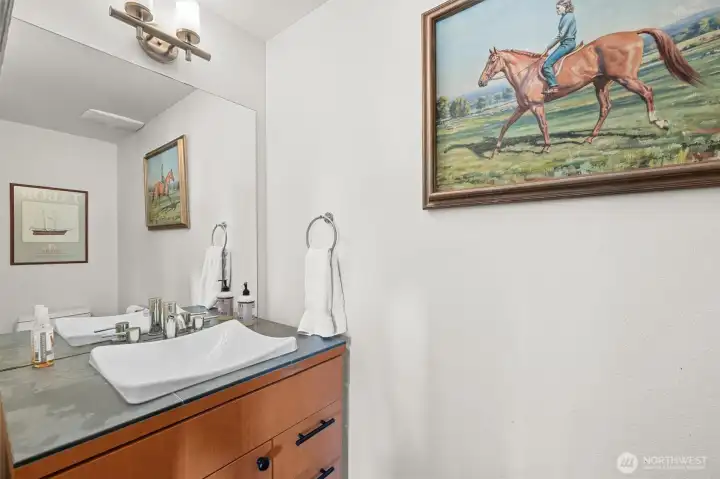 Half bath on lower level next to media or family room. Custom fixtures. Quality casement storage throughout.
