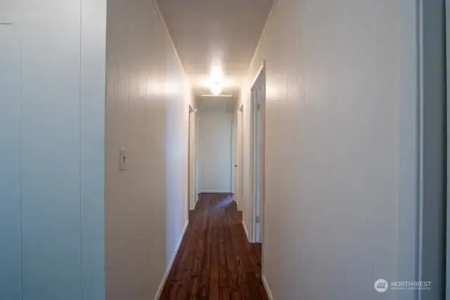 long hallway to 4 bedrooms plus main bath