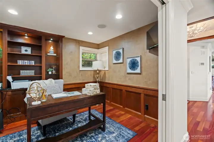 Main floor den with custom built-ins. Main floor den with custom built-ins.