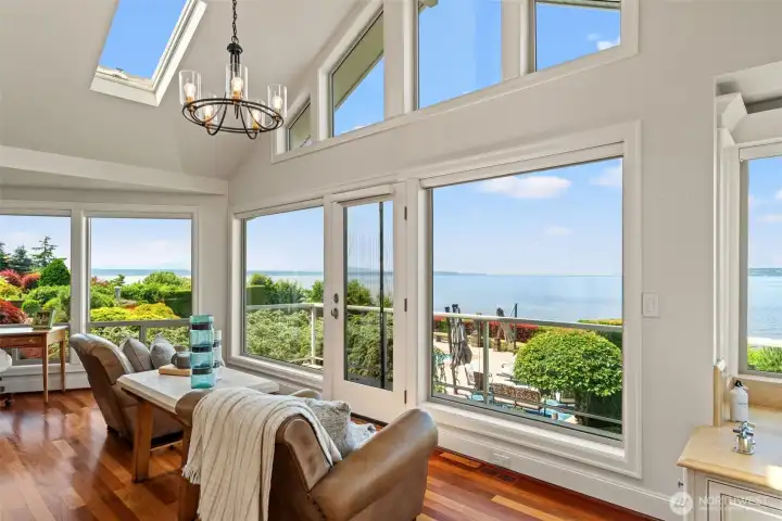 An adjoining sitting room with soaring vaulted ceilings and a wall of windows extends the primary suite - the perfect spot to start or end the day. An adjoining sitting room with soaring vaulted ceilings and a wall of windows extends the primary suite - the perfect spot to start or end the day.