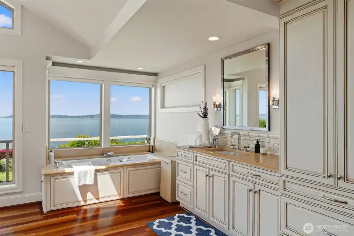 Soak in the view from the primary bath's tub, positioned to take full advantage of the Sound and mountain backdrop. Soak in the view from the primary bath's tub, positioned to take full advantage of the Sound and mountain backdrop.