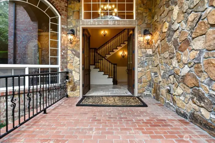 Front entrance, covered brick porch, French doors, stone exterior Front entrance, covered brick porch, French doors, stone exterior