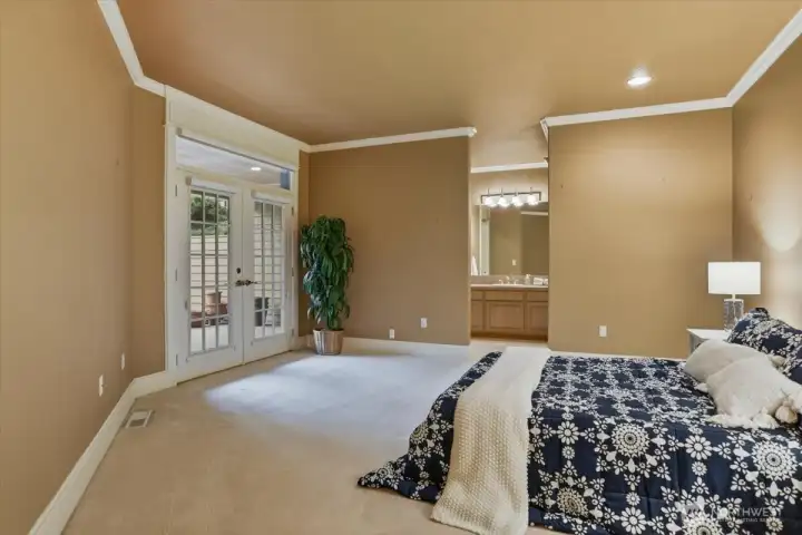 2nd primary bedroom on main, w2w carpet, ensuite bath, patio access, French doors, crown molding 2nd primary bedroom on main, w2w carpet, ensuite bath, patio access, French doors, crown molding