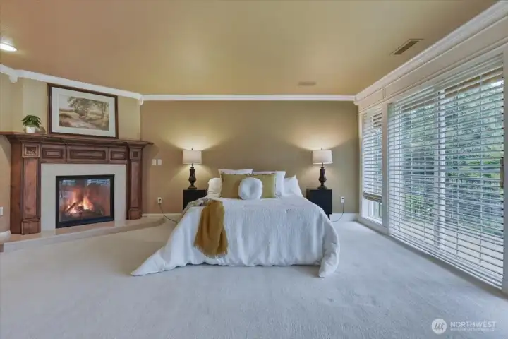 Primary bedroom, owners' suite, private balcony, fireplace, w2w carpet, crown molding, suite Primary bedroom, owners' suite, private balcony, fireplace, w2w carpet, crown molding, suite