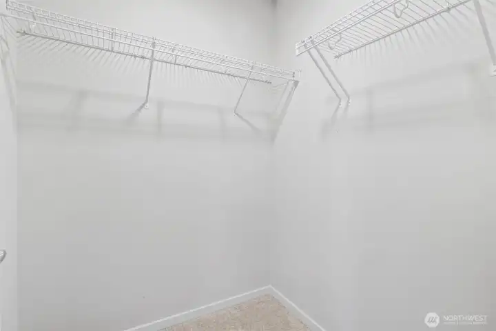 Oversized walk-in closet with ample storage space. Oversized walk-in closet with ample storage space.