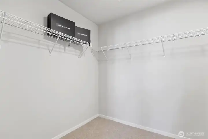 Large walk-in closet offers exceptional storage and organization opportunities. Large walk-in closet offers exceptional storage and organization opportunities.