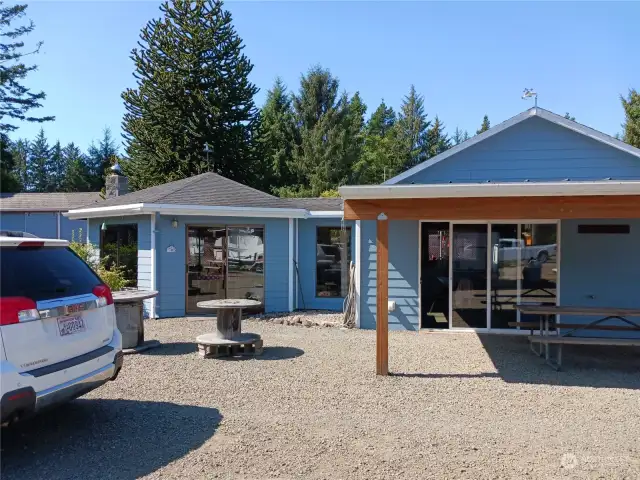 Gazebo with free standing stove with adjacent kitchen and dining area. Perfect for guests to have gatherings.