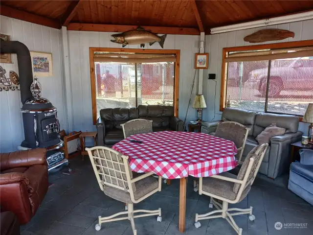 Inside of the gazebo with classic wood stove.