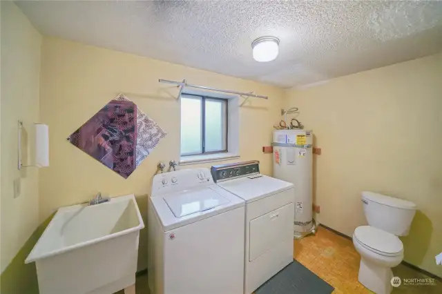 Lower level laundry and 1/4 bathroom