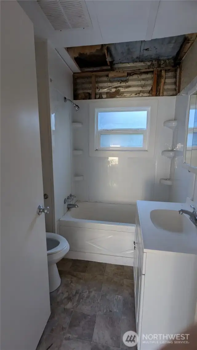 Bathroom, exposed exterior sheeting and ceiling/roof