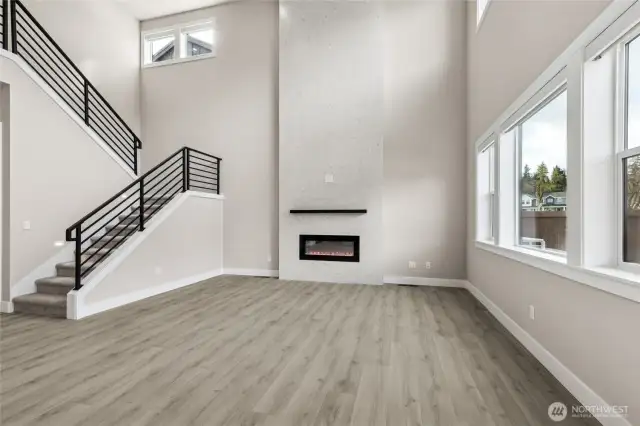 Dramatic fireplace with tile surround is a designers dream!