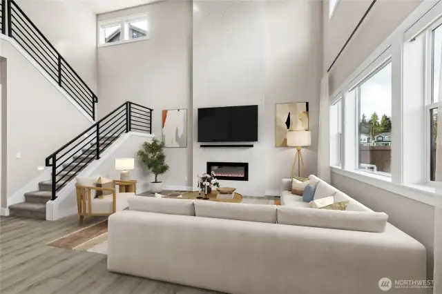 Living room overlooks fully landscaped and fenced backyard and the meadow, beyond. Virtual staging.