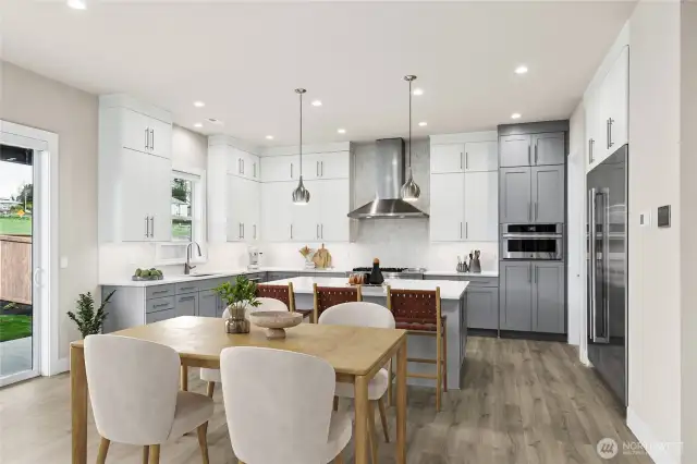 Kitchen and breakfast area opens to outside.  Kitchen features full height upper cabinets and 36" base cabinets.  An entertainers delight!