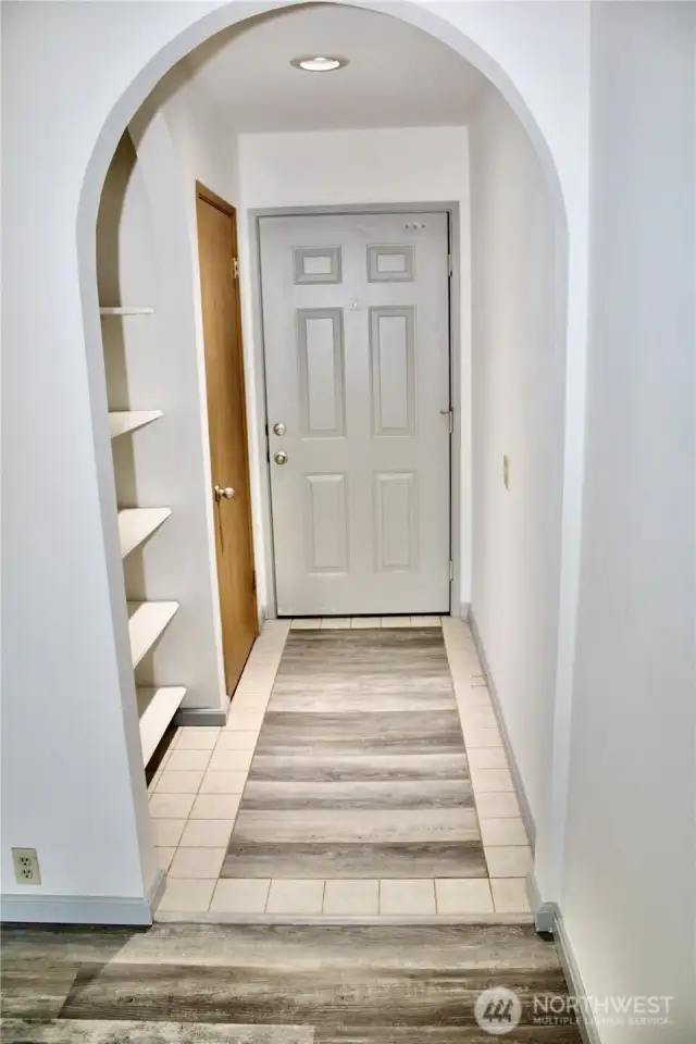 The entry is spacious with built in shelving