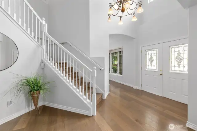 Entryway with grand staircase welcomes you inside.  Home has hard-surface flooring throughout.