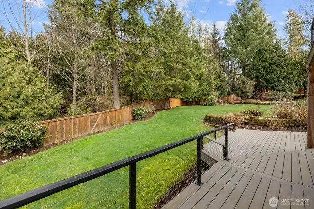 Very private backyard surrounded by trees and greenery.