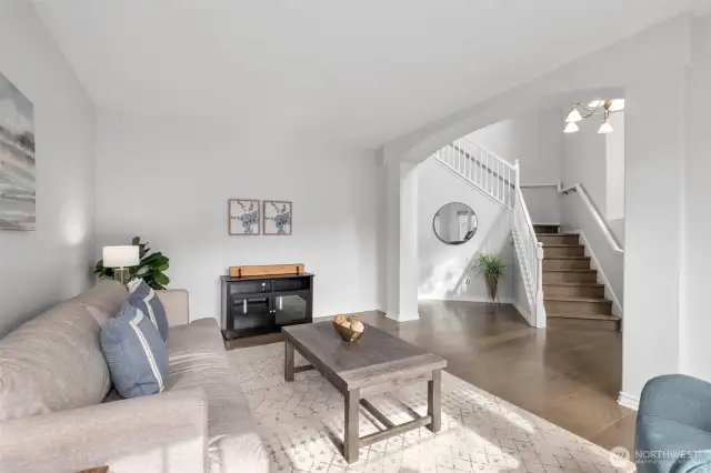 Another angle of the front room. Walk to the left of the stairs to head back to the kitchen.