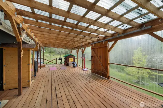 Gorgeous one of a kind barn door leading out to your own private oasis.  Sauna does not convey.