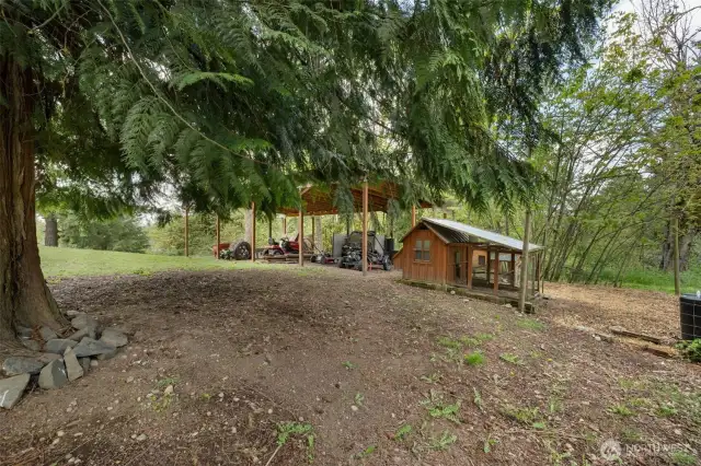 Nice view of the carport and chicken coop.