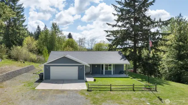 Adorable front yard.  Fantastic roof!