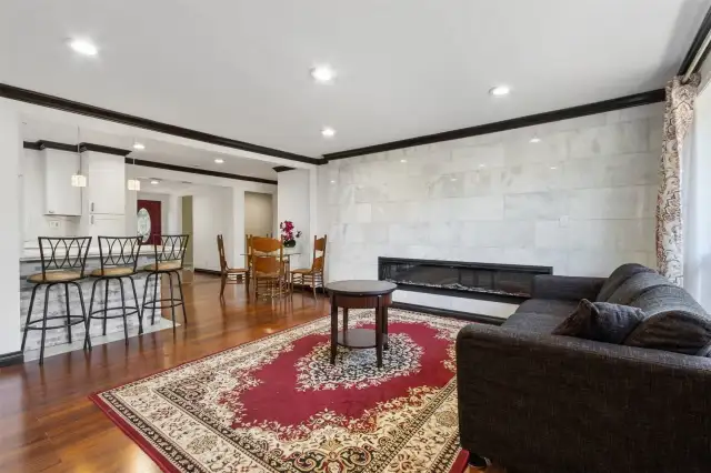 Open floor plan with hardwood floors throughout
