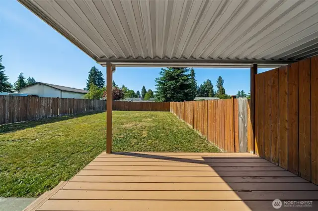 Deck to fully fenced backyard.