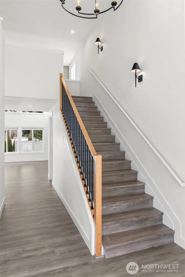 Grand Entry with Laminate hardwood on the stairs