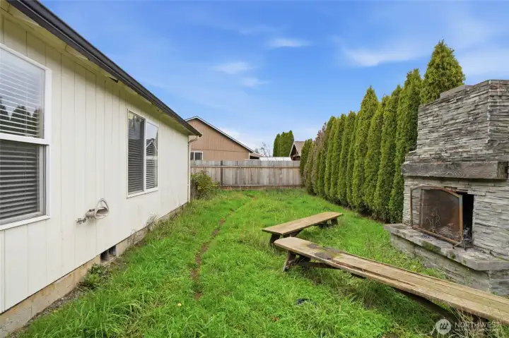 Backyard with outdoor fireplace