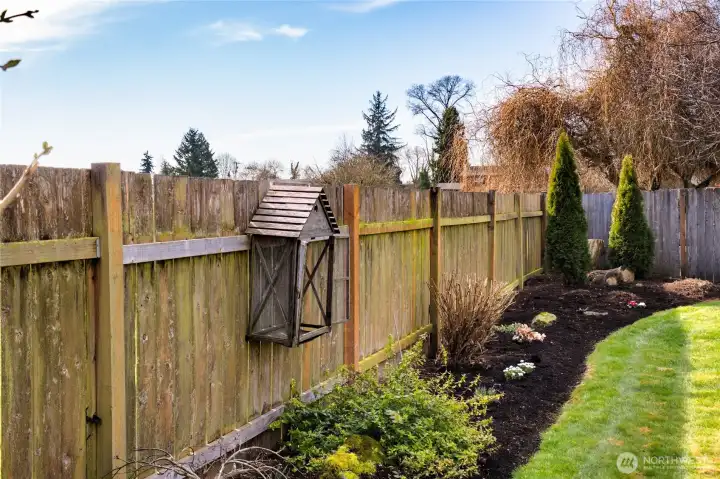 Back of lot is framed by lovely fresh landscaping and is show ready for Spring & Summer backyard gatherings.
