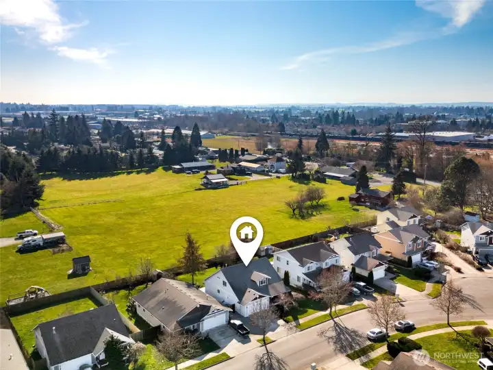 This is a sweet neighborhood with the perfect location backing up to an open manicured field offering nice privacy and views year round.