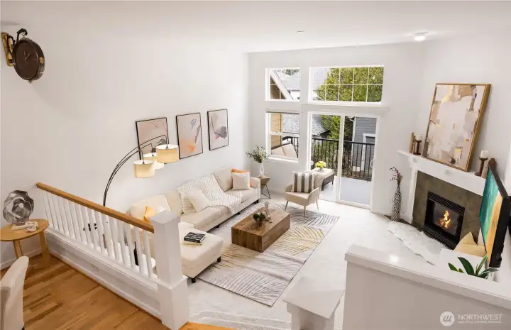 Sunlit living room with gas fireplace.