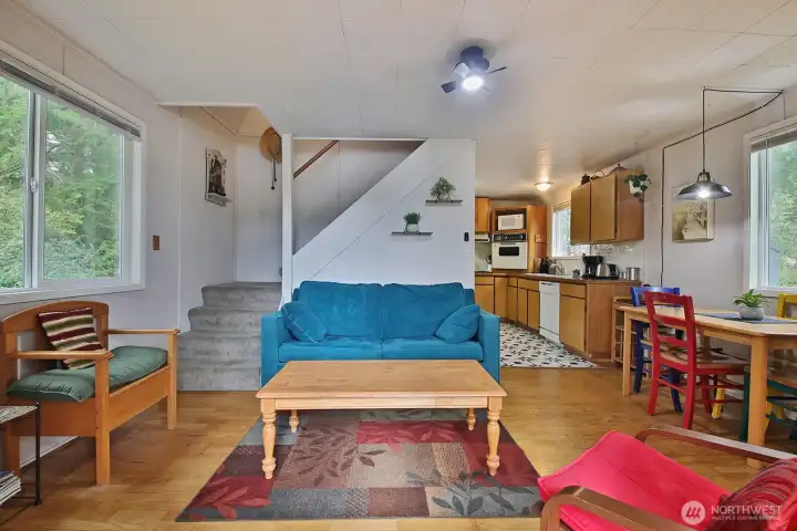 Canin -Living room. Stairs up to two guest rooms.