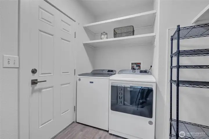 Private laundry room off of kitchen