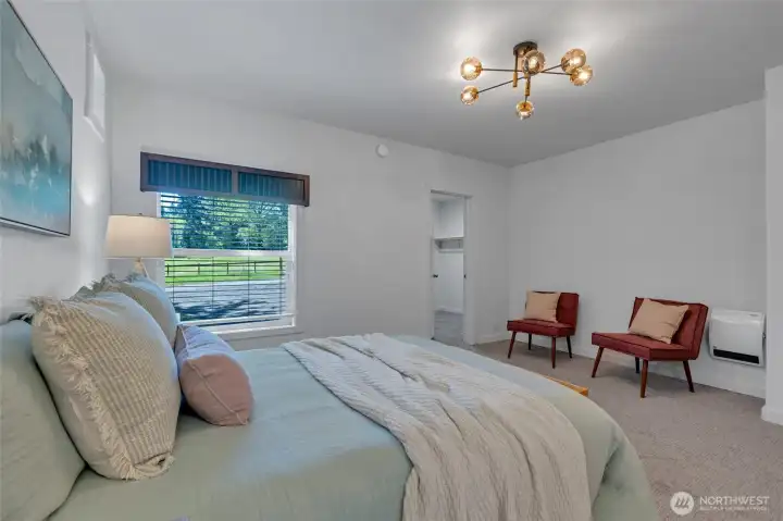 Large primary bedroom with walk-in closet and en suite bathroom