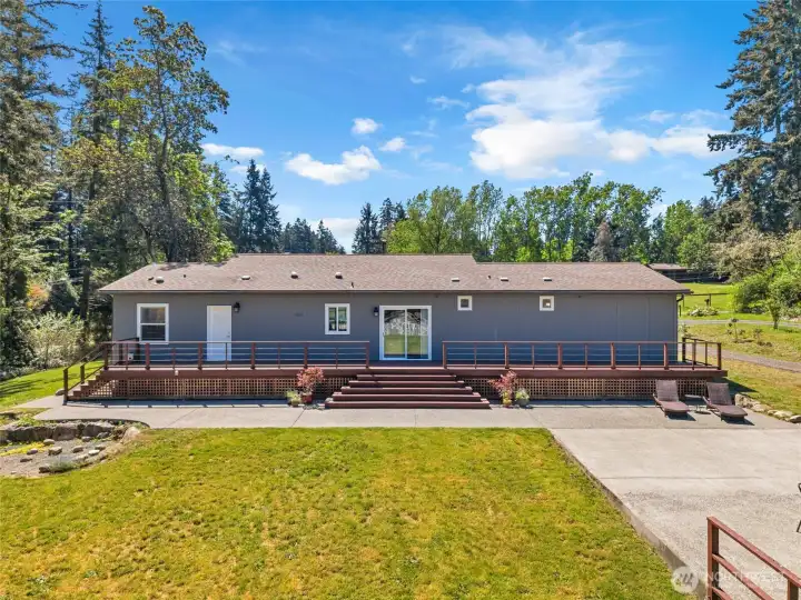 Large deck off of kitchen and concrete patio for entertaining