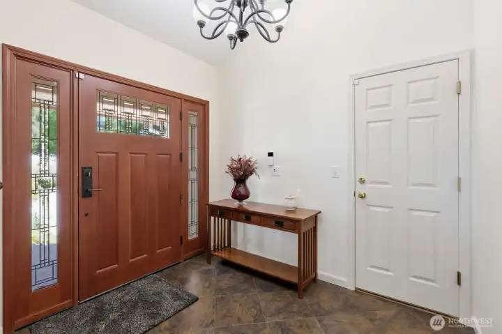 Grand entry with vaulted ceilings.
