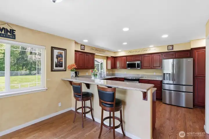 Informal kitchen dining room with slider to the  expansive deck.