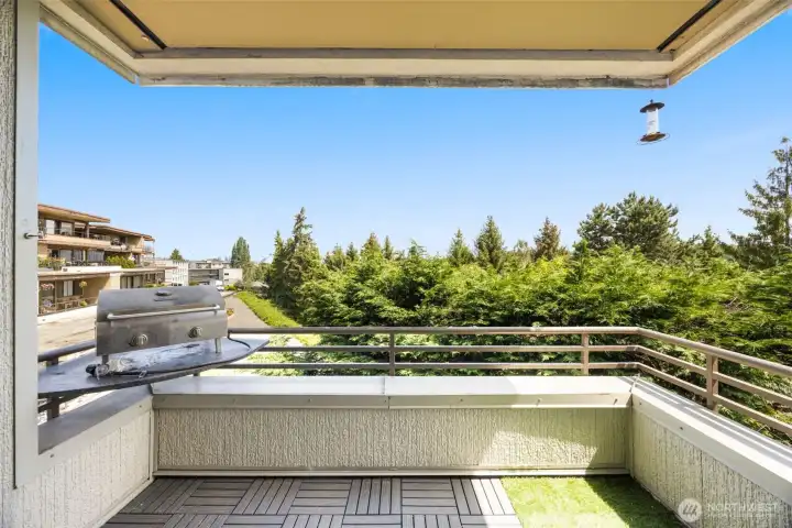 Private covered balcony—perfect for morning coffee against an iconic Space Needle backdrop.