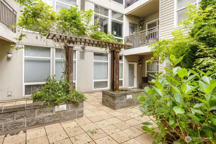 Beautifully manicured central courtyard offering a quiet, green outdoor escape
