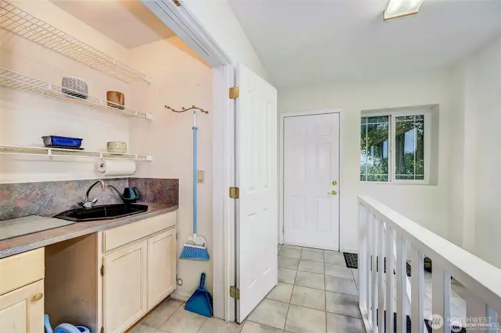Sun Room Off The Kitchen Area w/Another Staircase To Downstairs.