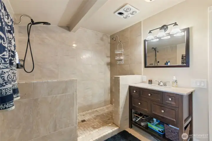 Primary bedroom has an en-suite bathroom with a walk-in tiled shower with dual shower heads Primary bedroom has an en-suite bathroom with a walk-in tiled shower with dual shower heads