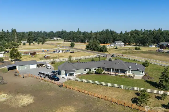 Room for horse trailers and truck beside the ADU to keep them out of sight. Barn has a attached Walk in Shed for Animals. Barn has garage section for more parking or storing equipment or hay.